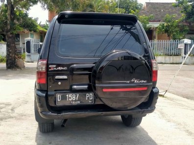 2011 Isuzu Panther GRAND TOURING Hitam - Jual mobil bekas di Jawa Barat